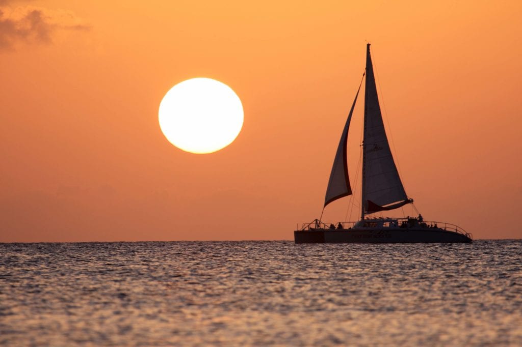 Red Sail Sports at Sunset - Cayman Islands Department of Tourism